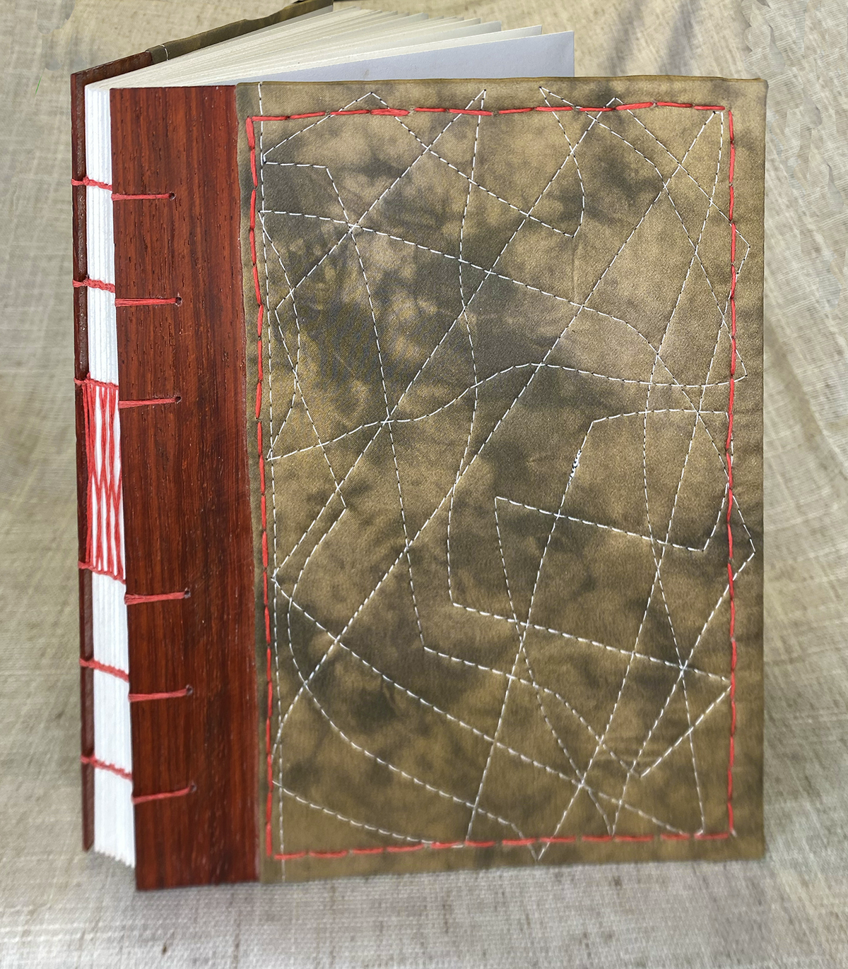 Journal-sized 6"x8" - Pomegranate + Iron Swirl Silk on Padauk Wood w/ Coral Stitching